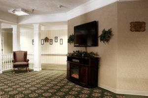 Cozy living room with a fireplace and mounted TV.