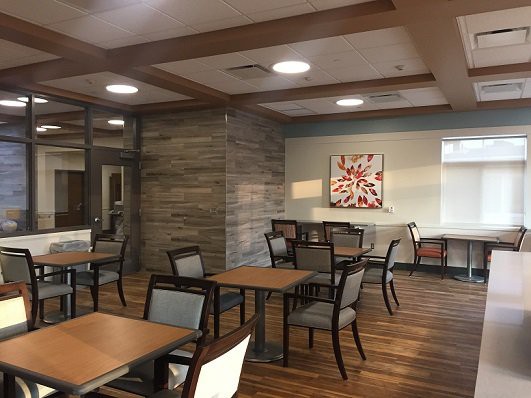 A modern dining area with wooden floors and stylish furniture.