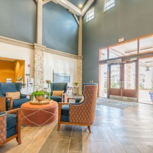 A modern, bright lobby with comfortable seating and elegant decor.