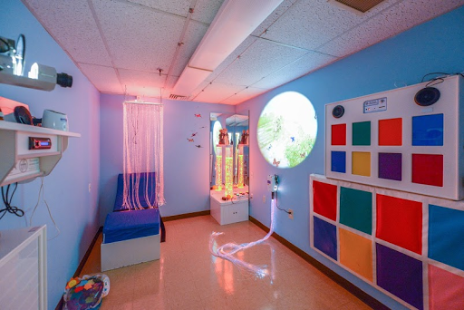 A serene therapy room designed to promote relaxation and sensory engagement.