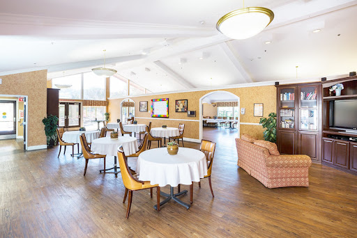A beautifully arranged dining area featuring elegant tables and comfortable seating.
