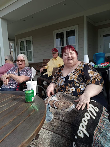 A cheerful gathering of friends enjoying a sunny day outdoors.