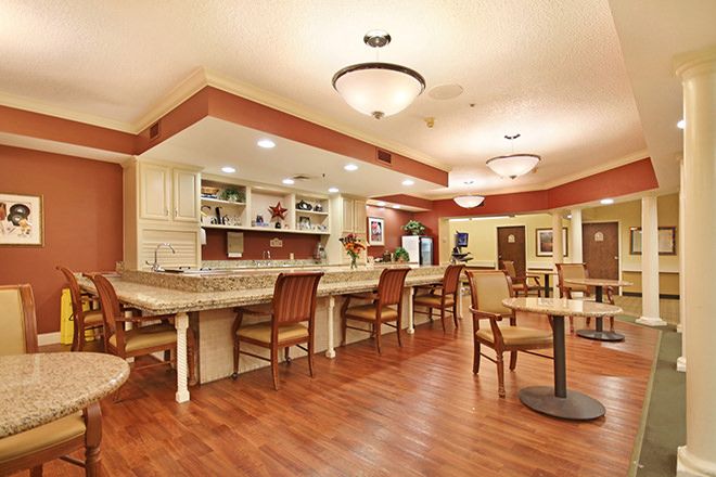 A cozy dining area with a bar counter and comfortable seating.
