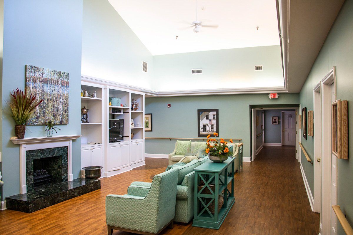 A modern lounge area with pastel-colored furniture and decorative items.