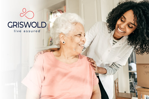 A caregiver shares a joyful moment with an elderly woman, highlighting the importance of support and companionship in home care.