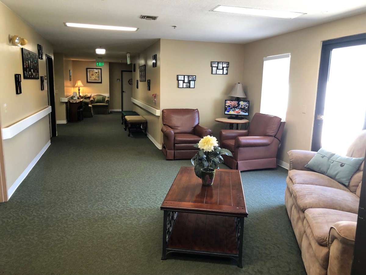 A cozy living room area with comfortable seating and tasteful decorations.