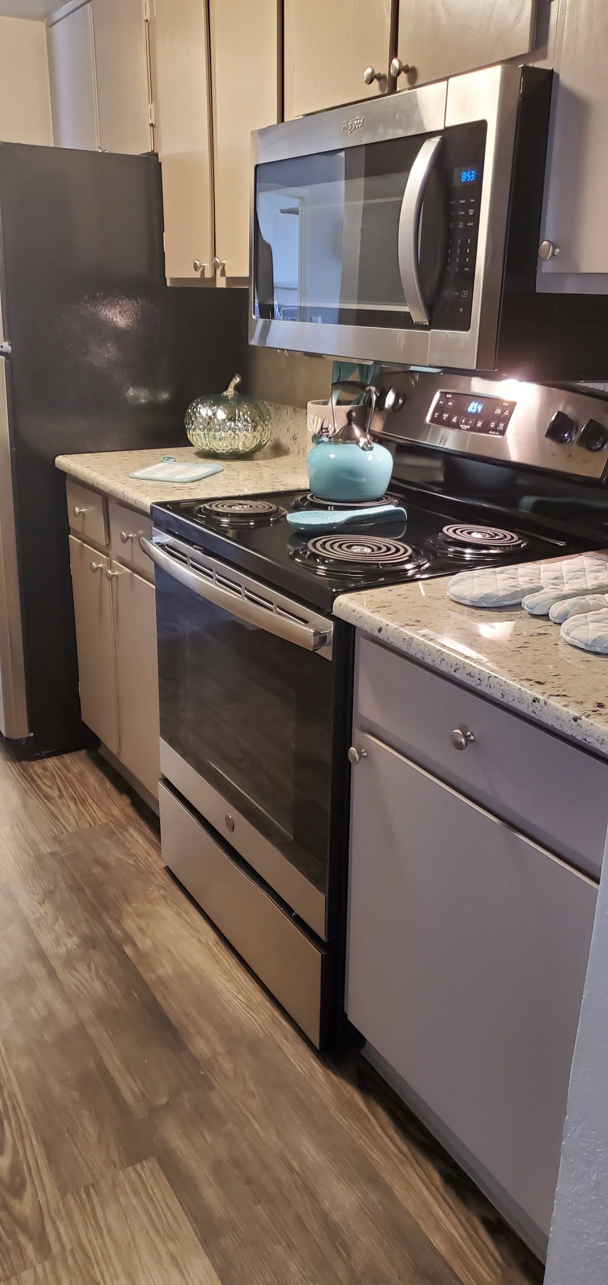 A modern kitchen featuring a sleek stove and countertop setup.