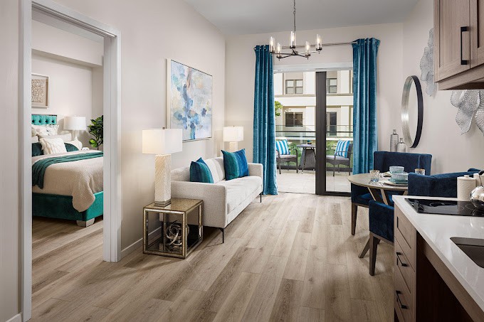 A modern living room with bright blue accents and elegant decor.