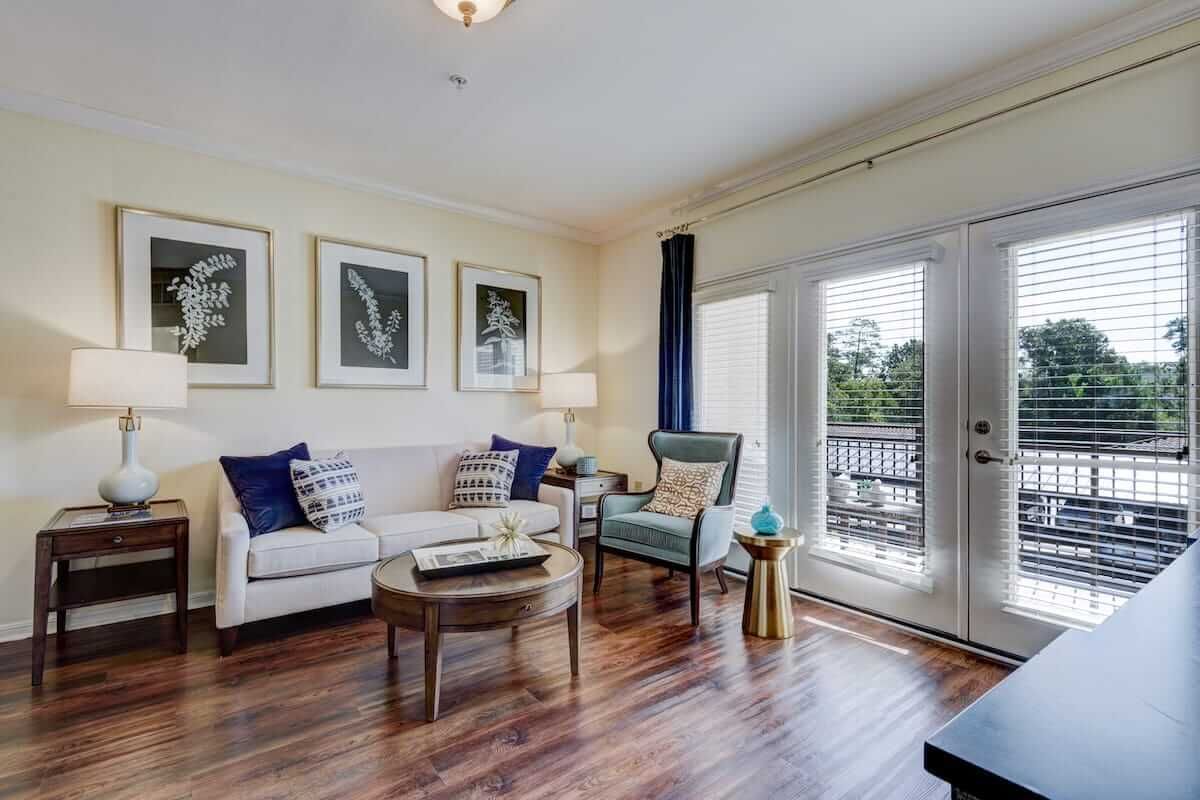 A cozy and well-lit living room featuring elegant furniture and stylish decor.