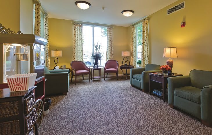 Cozy living room with ample seating and warm lighting.