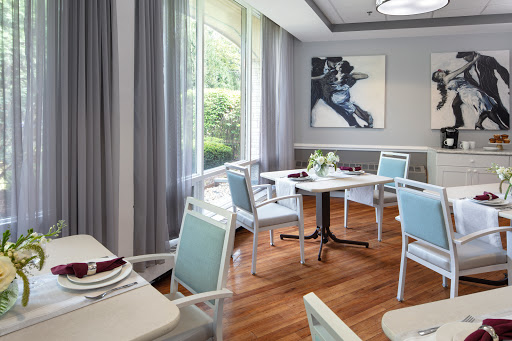 A stylish dining area with modern furniture and a touch of natural light.