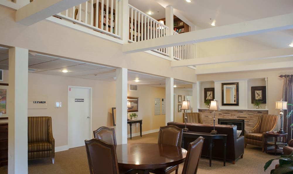 A modern open-plan living and dining area with a loft.