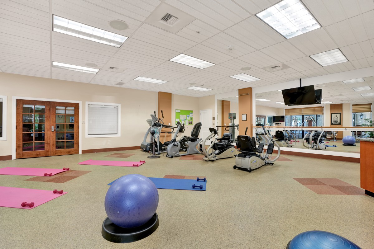 A well-equipped gym featuring various exercise machines and fitness accessories.