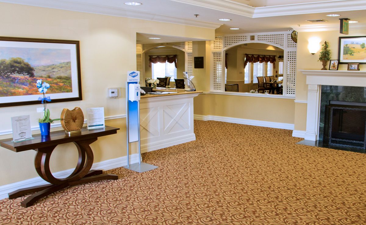 A welcoming hotel lobby with a reception desk and comfortable decor.
