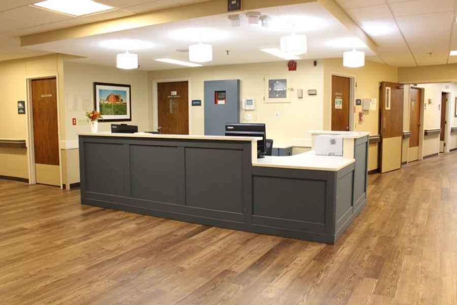 A modern hospital reception desk in a healthcare facility.