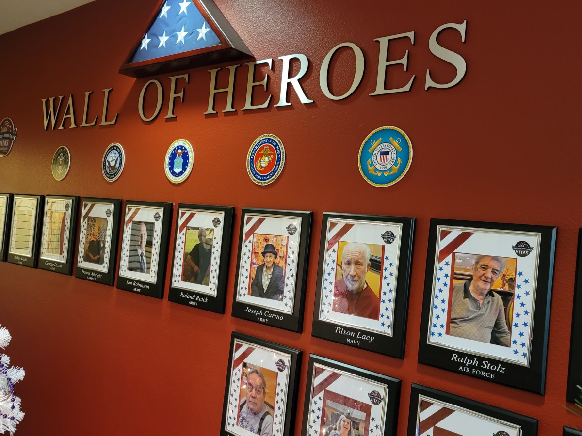 A Wall of Heroes showcasing portraits and honoring military veterans.