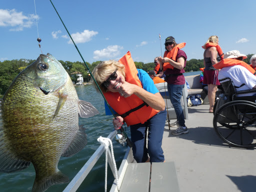 A fun day out on the water, celebrating a successful fishing trip with friends.
