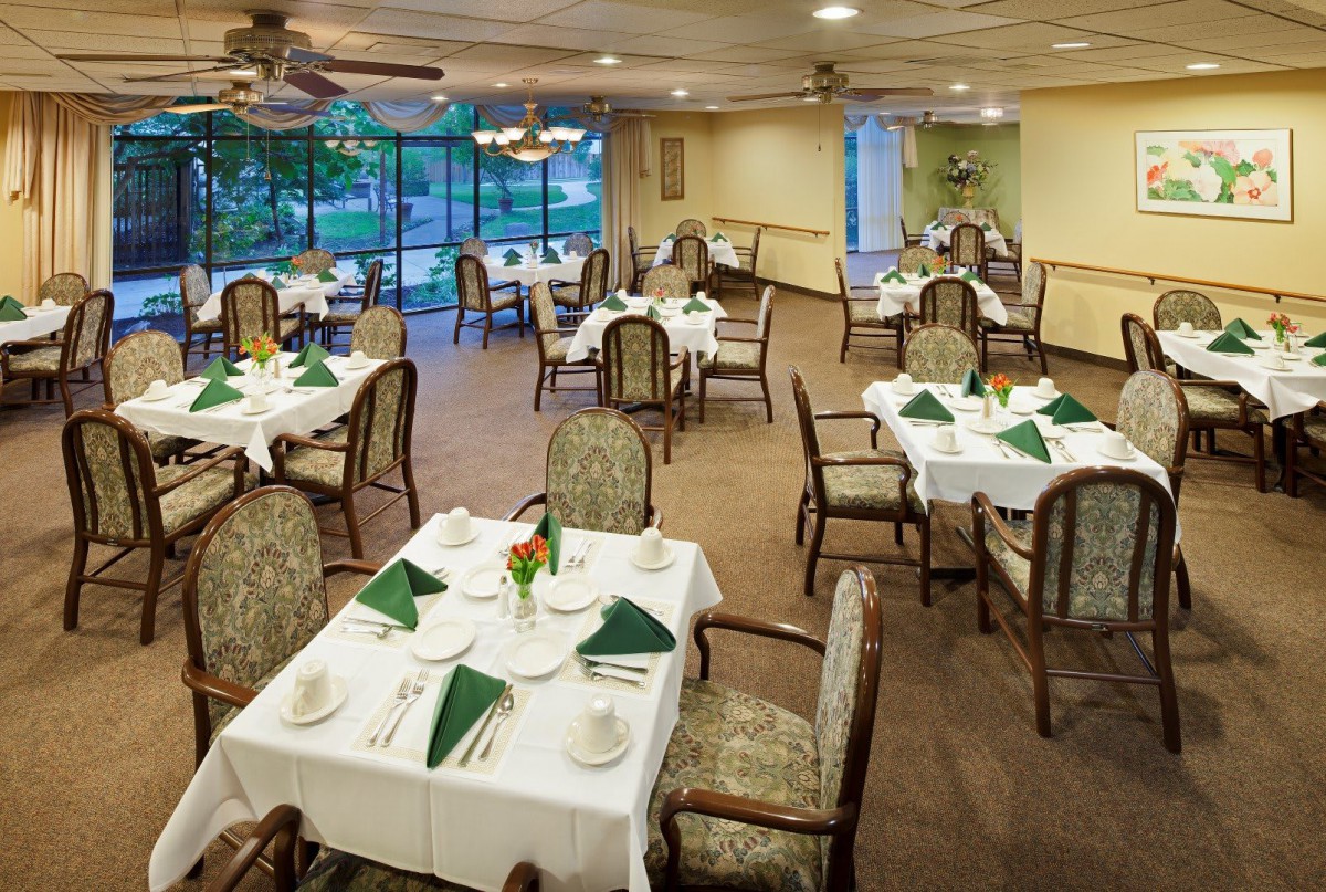 An elegant dining room with neatly arranged tables and chairs, ready for guests.