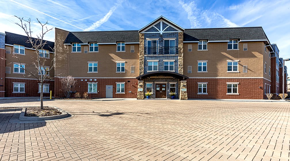 A modern residential apartment building on a sunny day.
