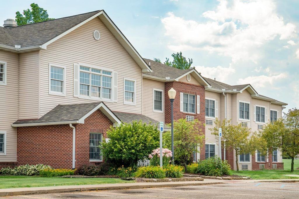 A suburban residential building with a well-maintained landscape.