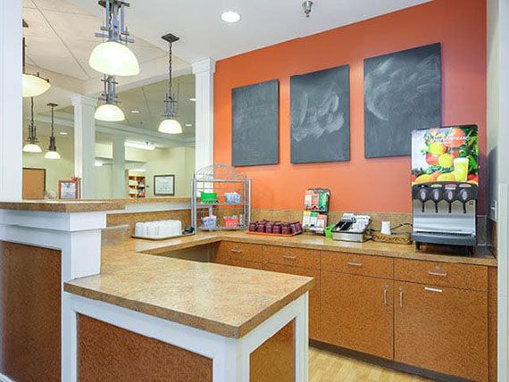 A modern kitchen counter setup in a restaurant or cafe interior.