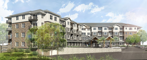 A modern residential building featuring multiple levels with contemporary architecture and landscaped surroundings.