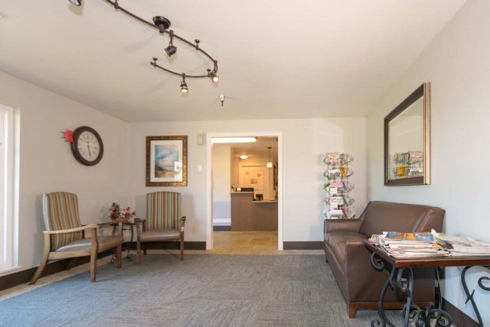 A cozy waiting room with comfortable seating and tasteful decor.