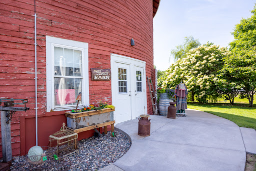 A charming red barn exterior, complete with rustic decorations and a welcoming entrance.