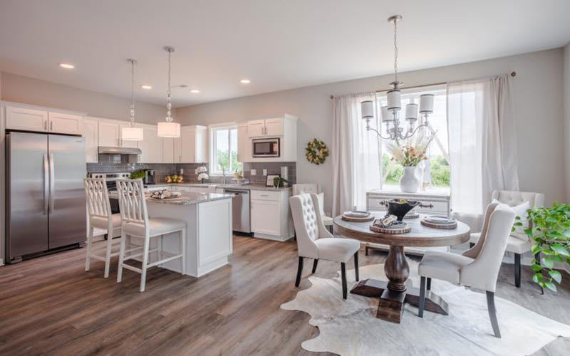 A modern open-concept kitchen and dining area with elegant interior design.