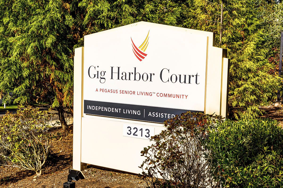 Sign for Gig Harbor Court, a senior living community.