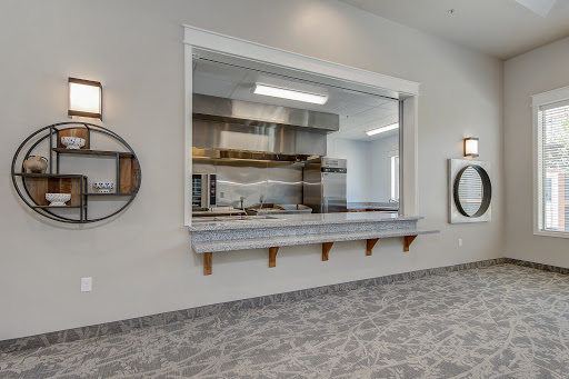 A modern kitchen showcasing an open design with ample cooking space and contemporary decor.
