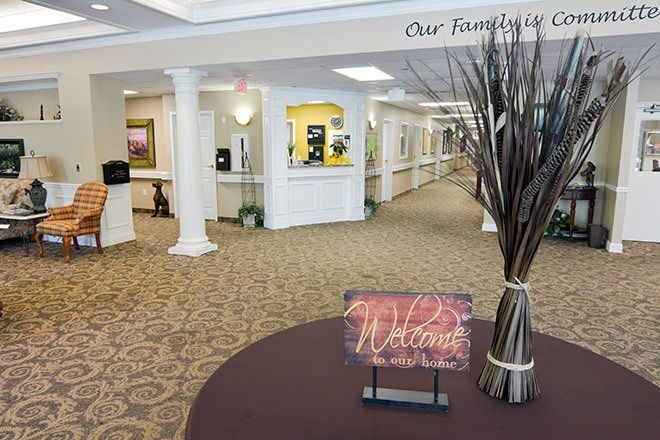 A welcoming lobby area with a 'Welcome' sign and decorative elements.