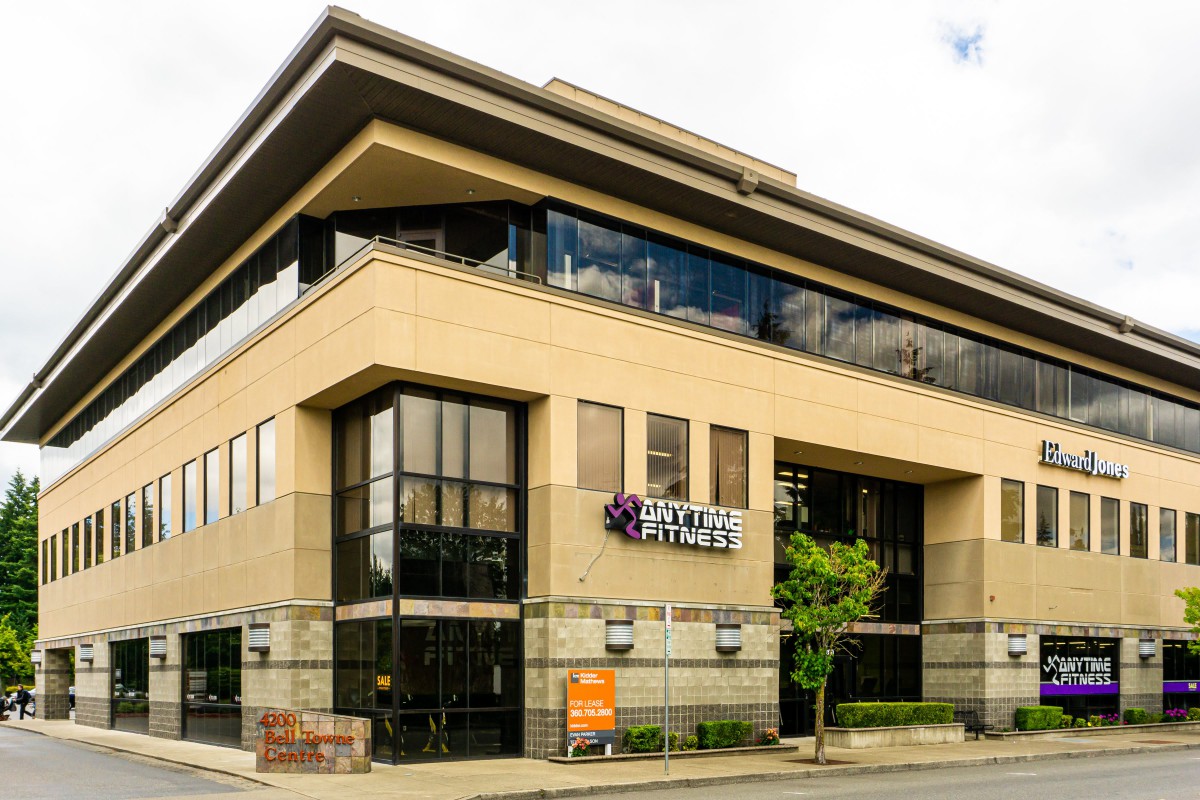 Exterior view of a modern fitness center in an urban area.