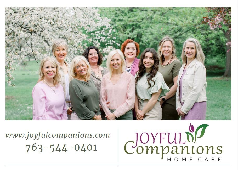 A group of women standing together in an outdoor setting, representing Joyful Companions Home Care.