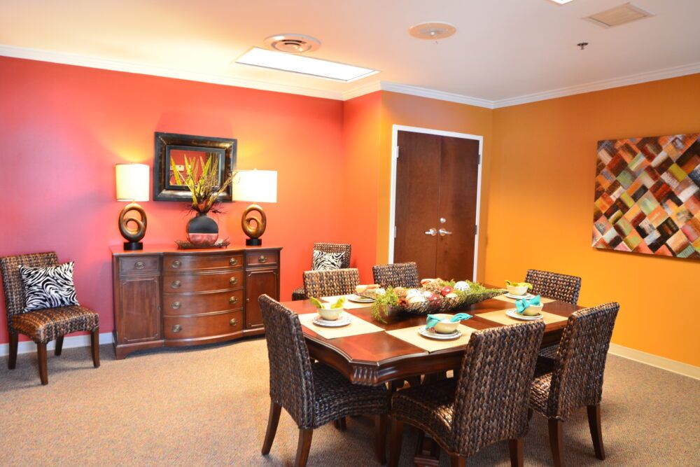 A vibrant dining room with a colorful wall and stylish decor.