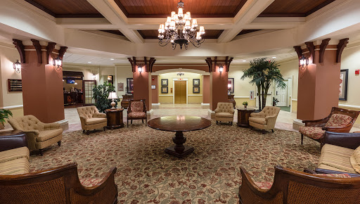 A beautifully designed lobby featuring elegant furniture and a stunning chandelier.