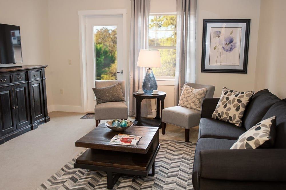 A modern living room with cozy furniture and elegant decor.