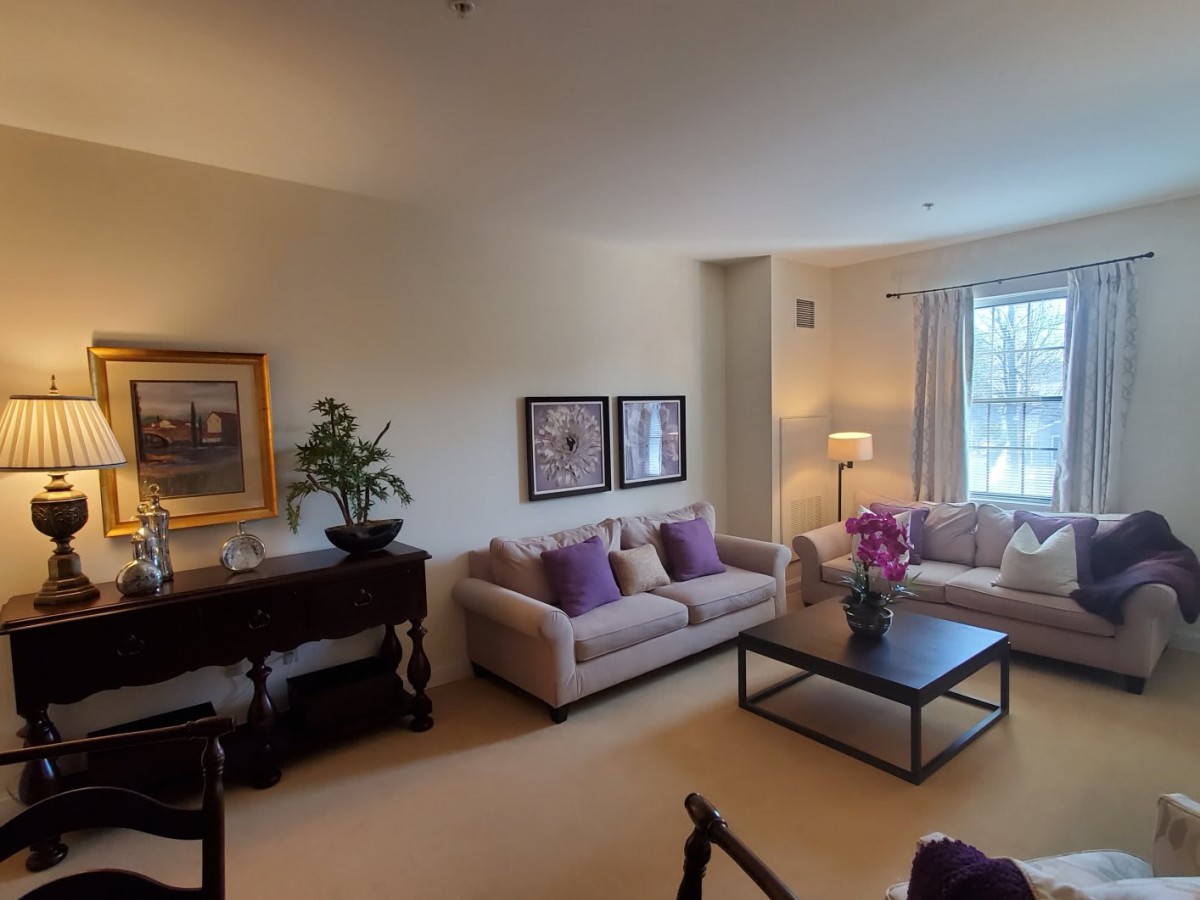 A cozy living room with comfortable seating and elegant decor.