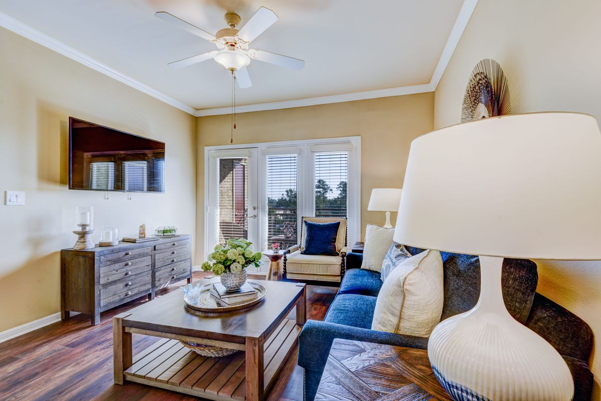 A cozy living room with modern furnishings and natural lighting.