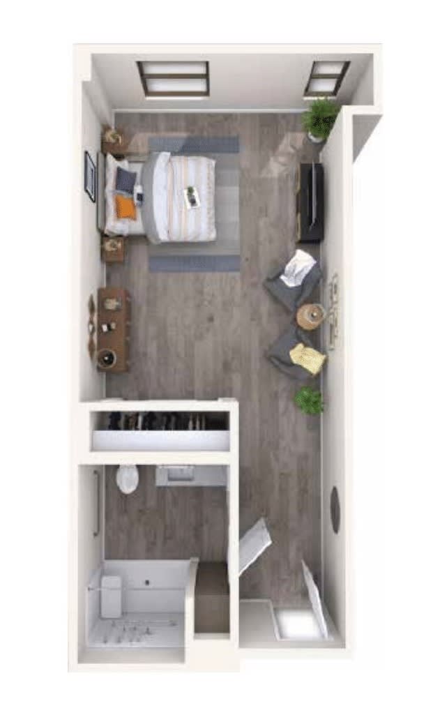 A top-down view of a compact studio apartment layout with a bedroom, living area, and bathroom.