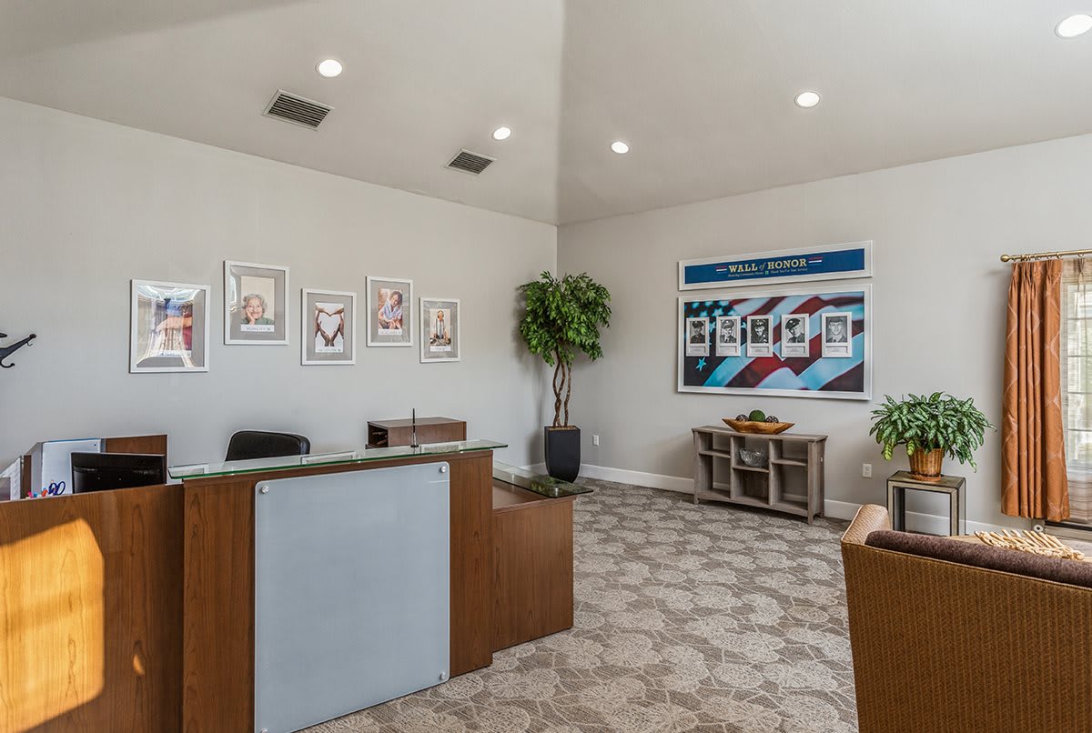 A modern office reception area with seating and decorative elements.