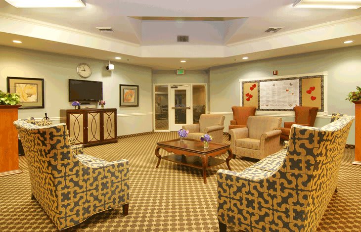 A cozy living room with comfortable seating and a television.