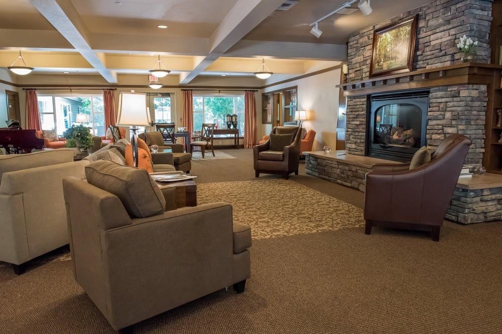A cozy living room with comfortable seating and a fireplace.