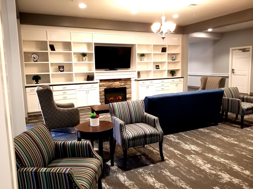 A cozy living room with comfortable seating and a fireplace.