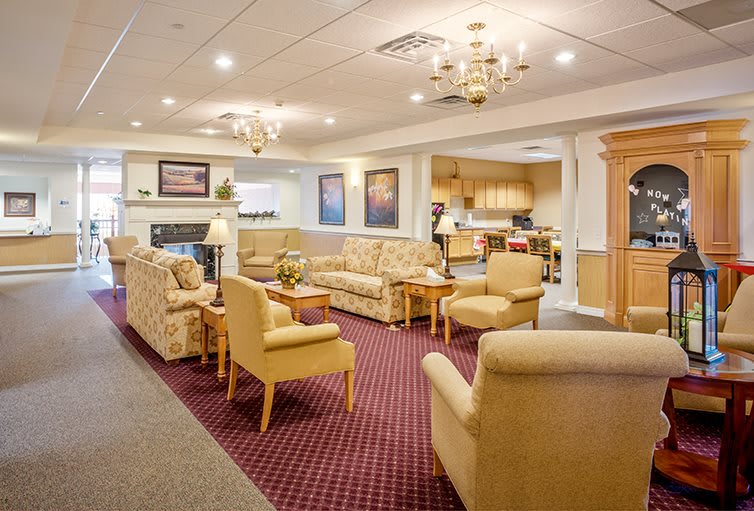 A cozy living room with comfortable seating and elegant lighting.