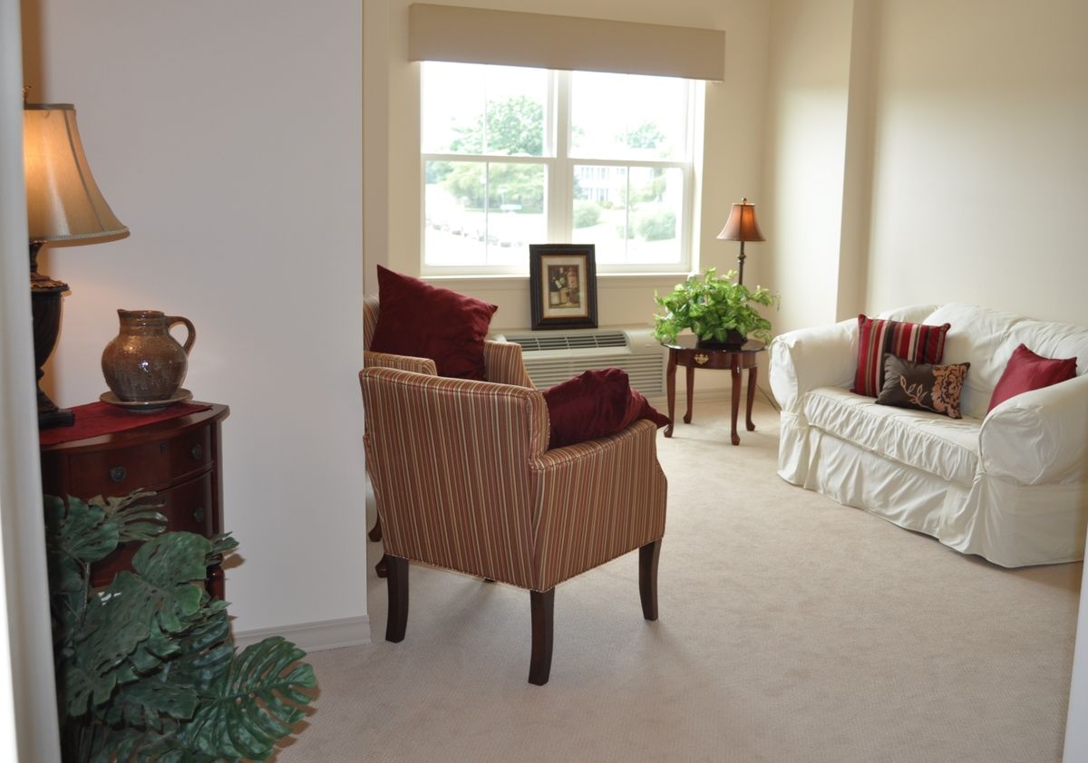 A cozy living room with comfortable seating and natural light.