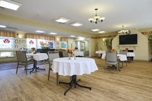 A cozy dining area featuring neatly arranged tables and a warm, inviting atmosphere.