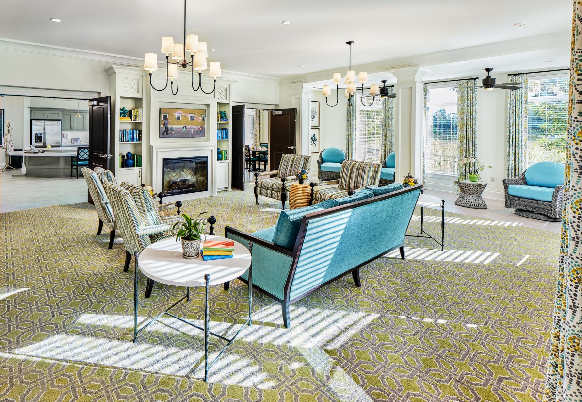 A beautifully decorated modern living room with stylish furniture and bright lighting.