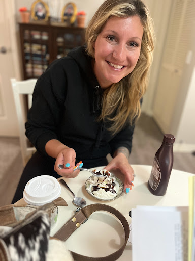 Enjoying a delicious dessert with a big smile!
