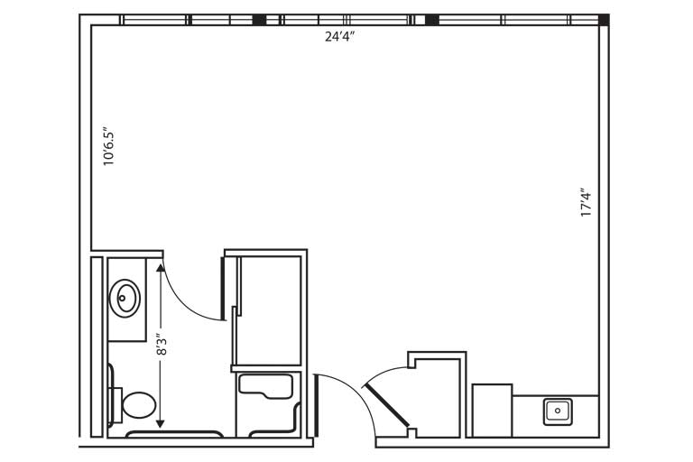 An architectural floor plan showing the layout of a small apartment with a bathroom and kitchen area.